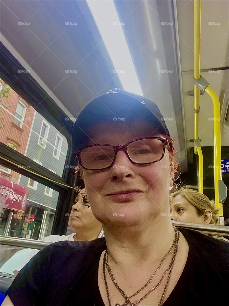This is me, “Petra Schiller” a.k.a. “Maxine Firefox” with new hat and glasses riding the “B 43” bus home to “Newtown Creek” from “Bushwick”, Brooklyn. 2023. Hypnotic Productions