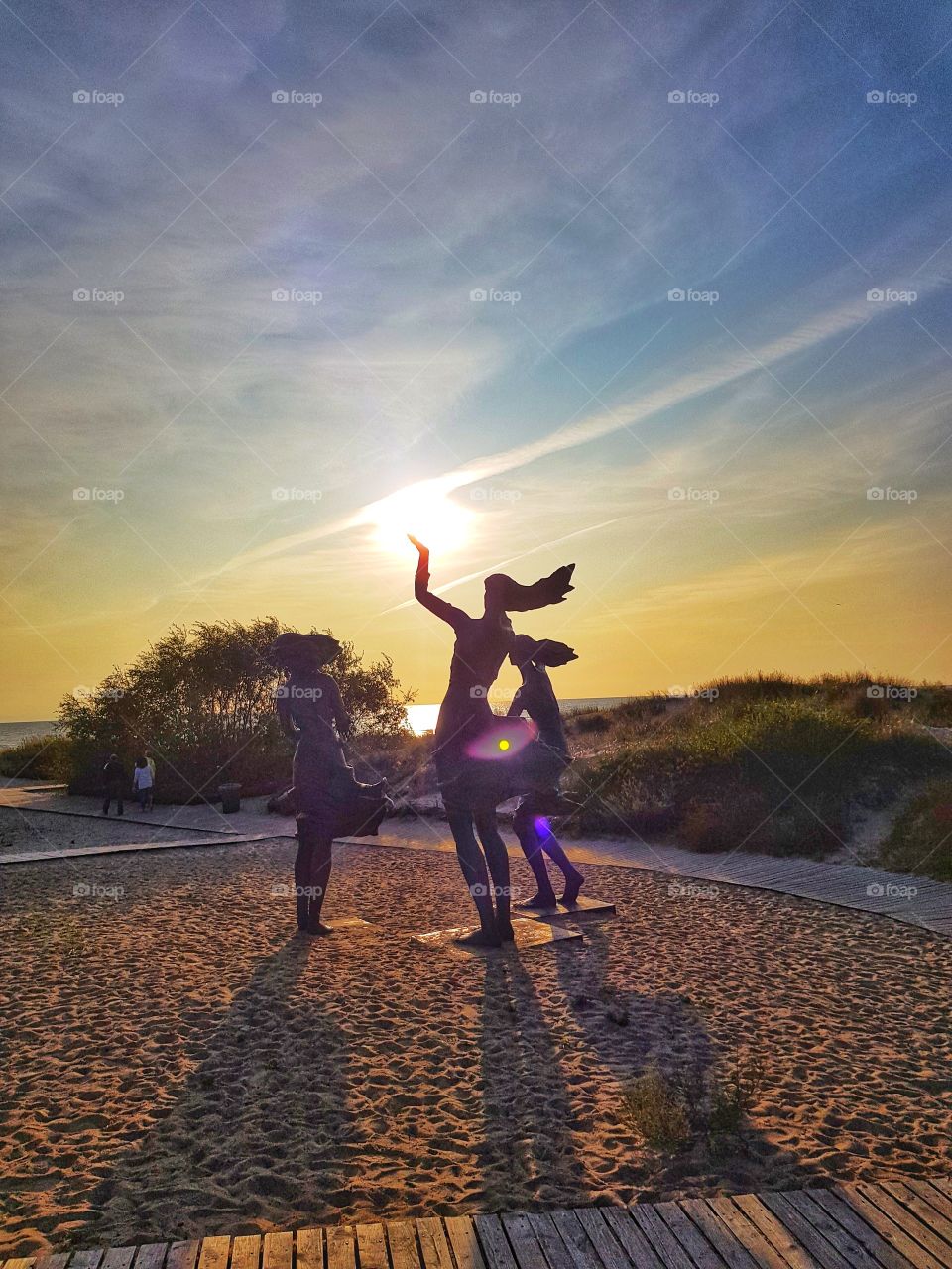 Three sisters holding the sun.