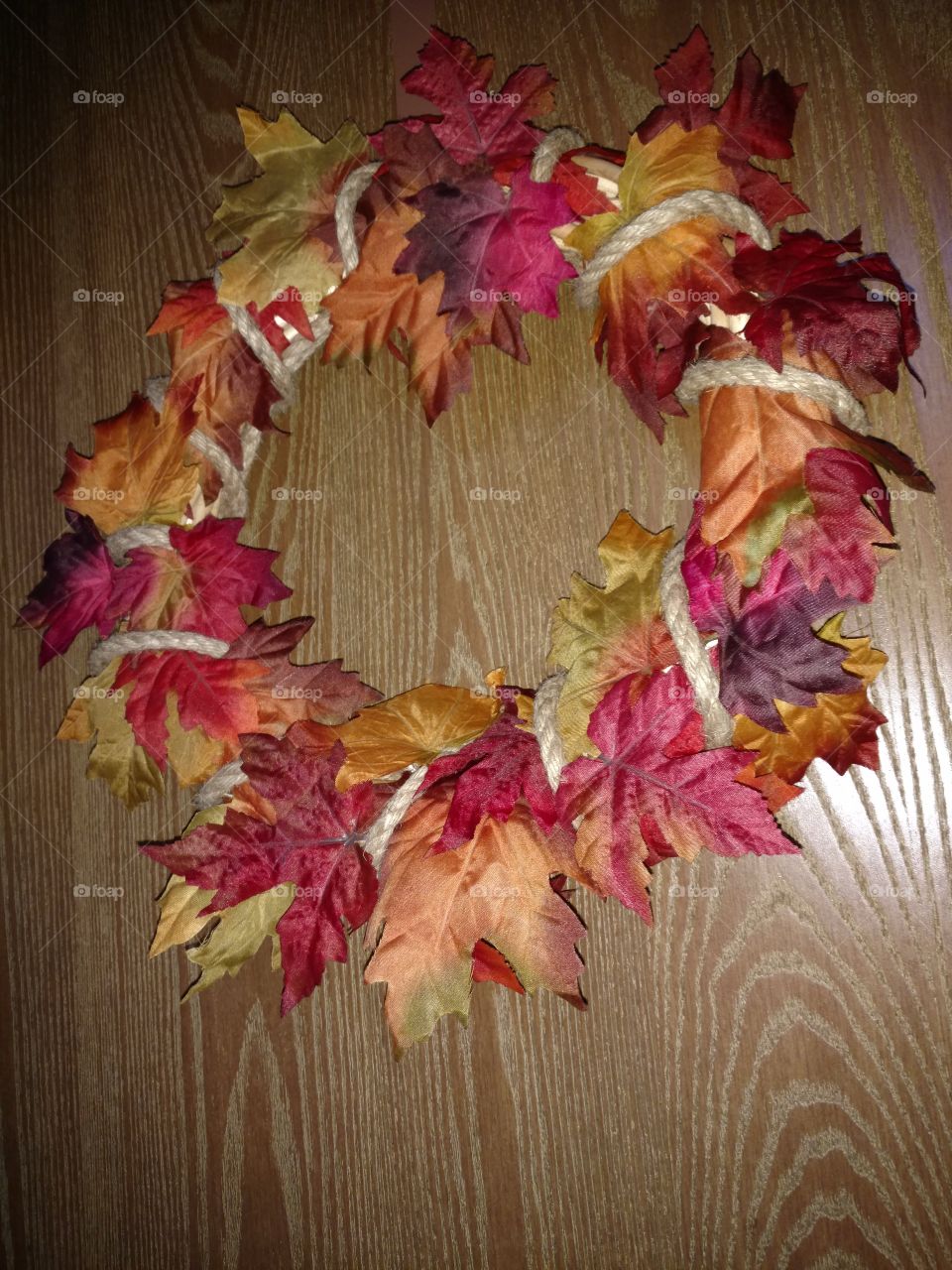 Autumn fall leaf wreath with rope holding it together