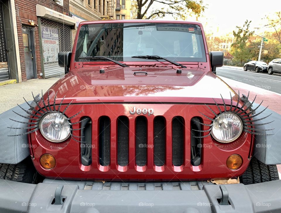 Eyelashes design of the headlight of the red car 