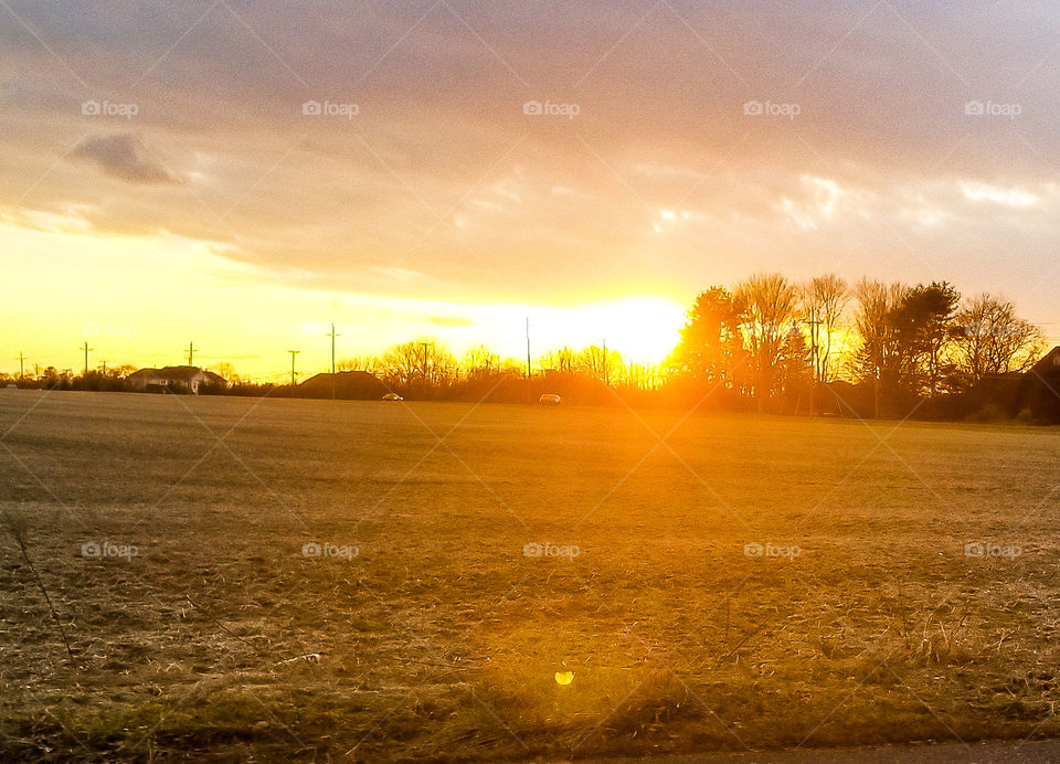 Sunset over an open field