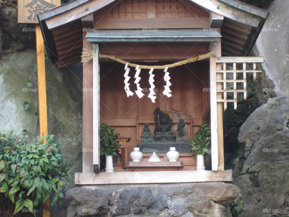 Tokyo, Japan.  Traditional Shrine in City Alleyway