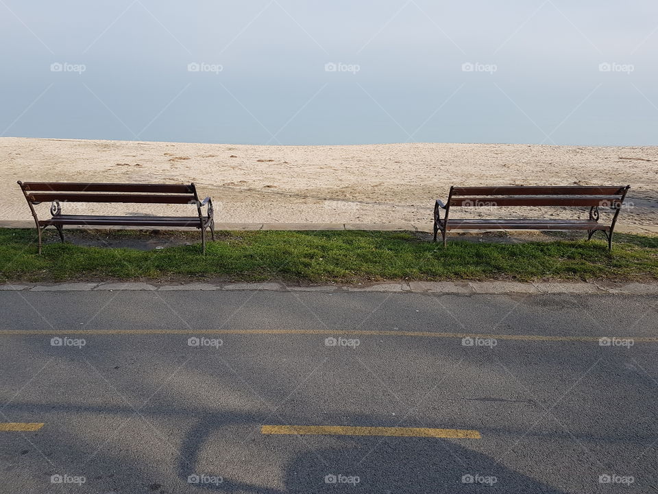 Two benches by the sea