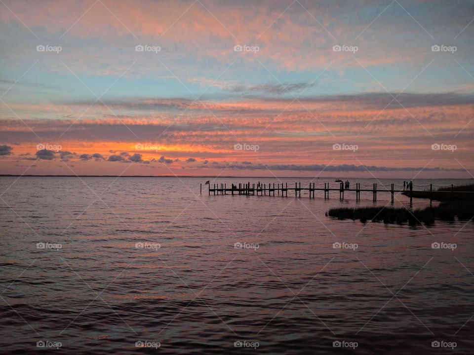 orange sunset with pier