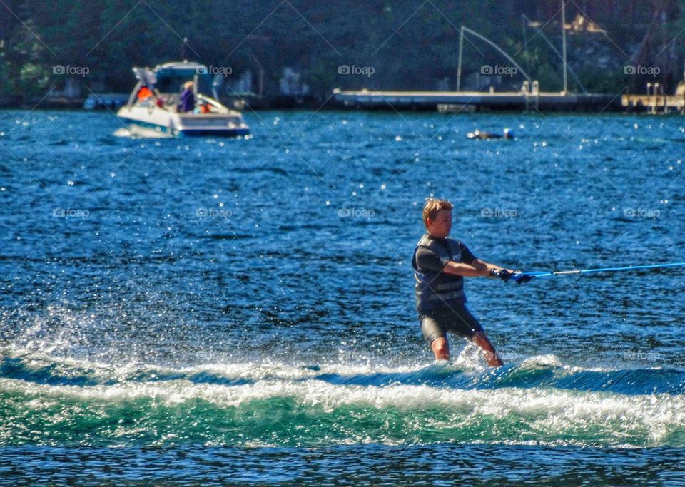 Water Ski On A Lake. Water Sports In Summertime
