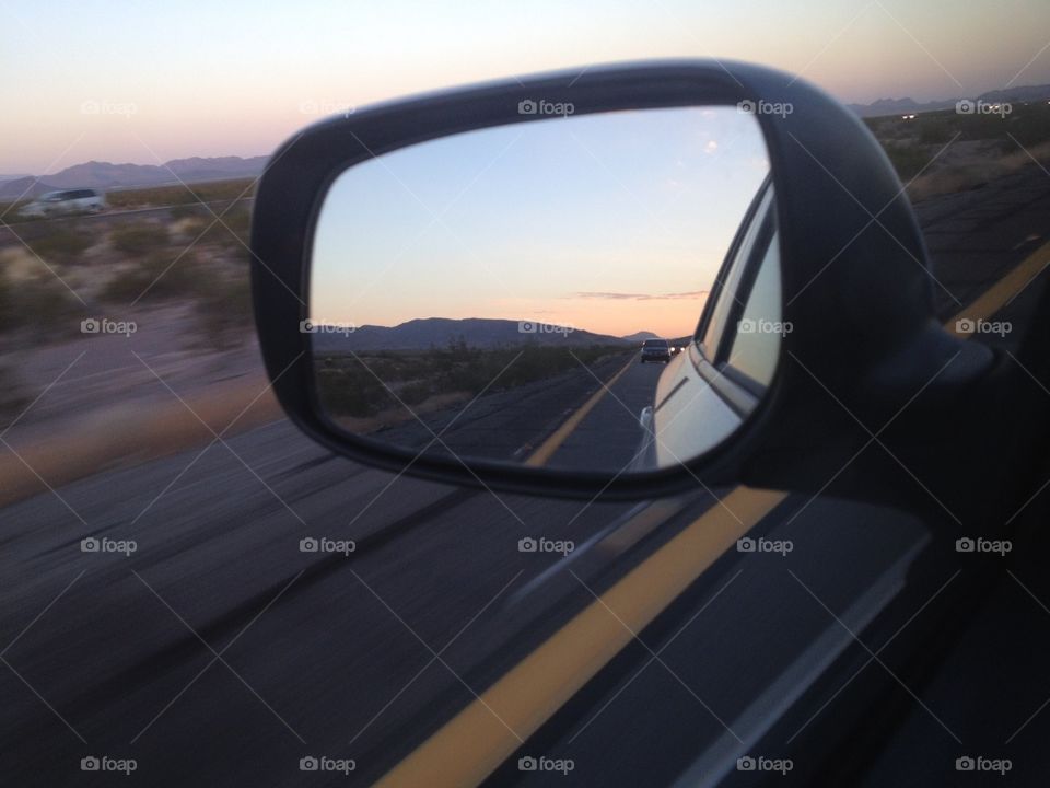 Side view mirror view on a road trip to Arizona