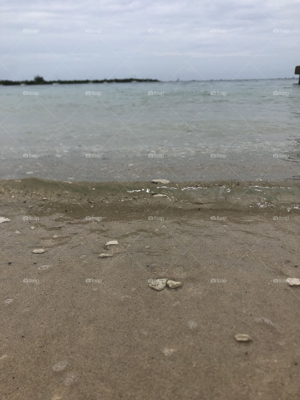 A picture of the clear, translucent water at low tide on Simonton Beach in Key West, FL