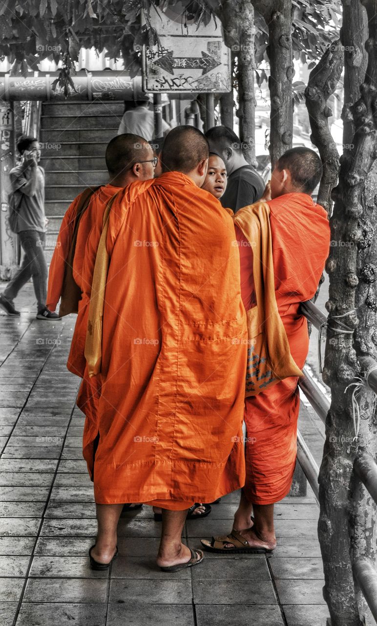 Thai Buddhist monks on streets of Bangkok Thailand.