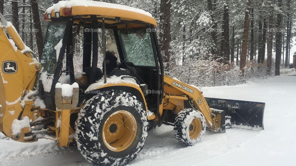 Plowing snow in the winter. 