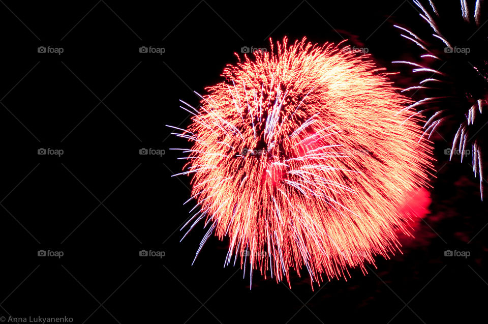 Fireworks with red and orange lights 