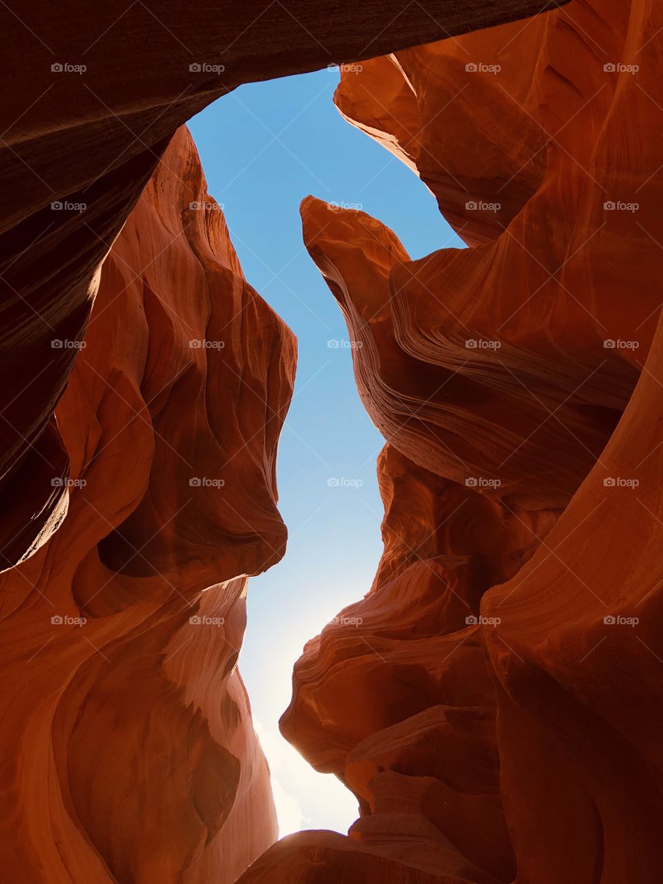 The beautiful reds of Antelope Canyon up against the blue of the clear sky. 