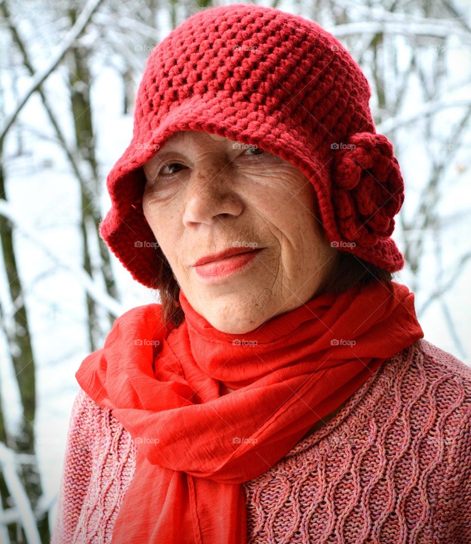 woman in red hat winter background