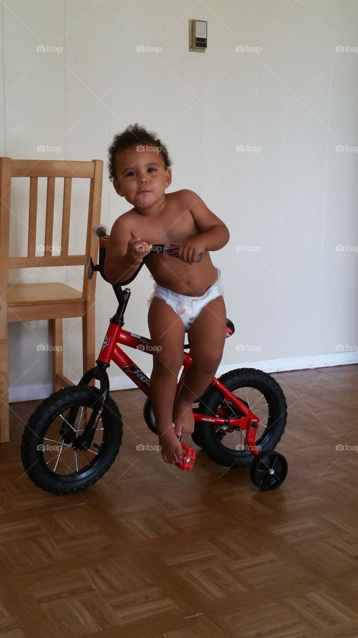 Biker Boy. My son getting off his first bike