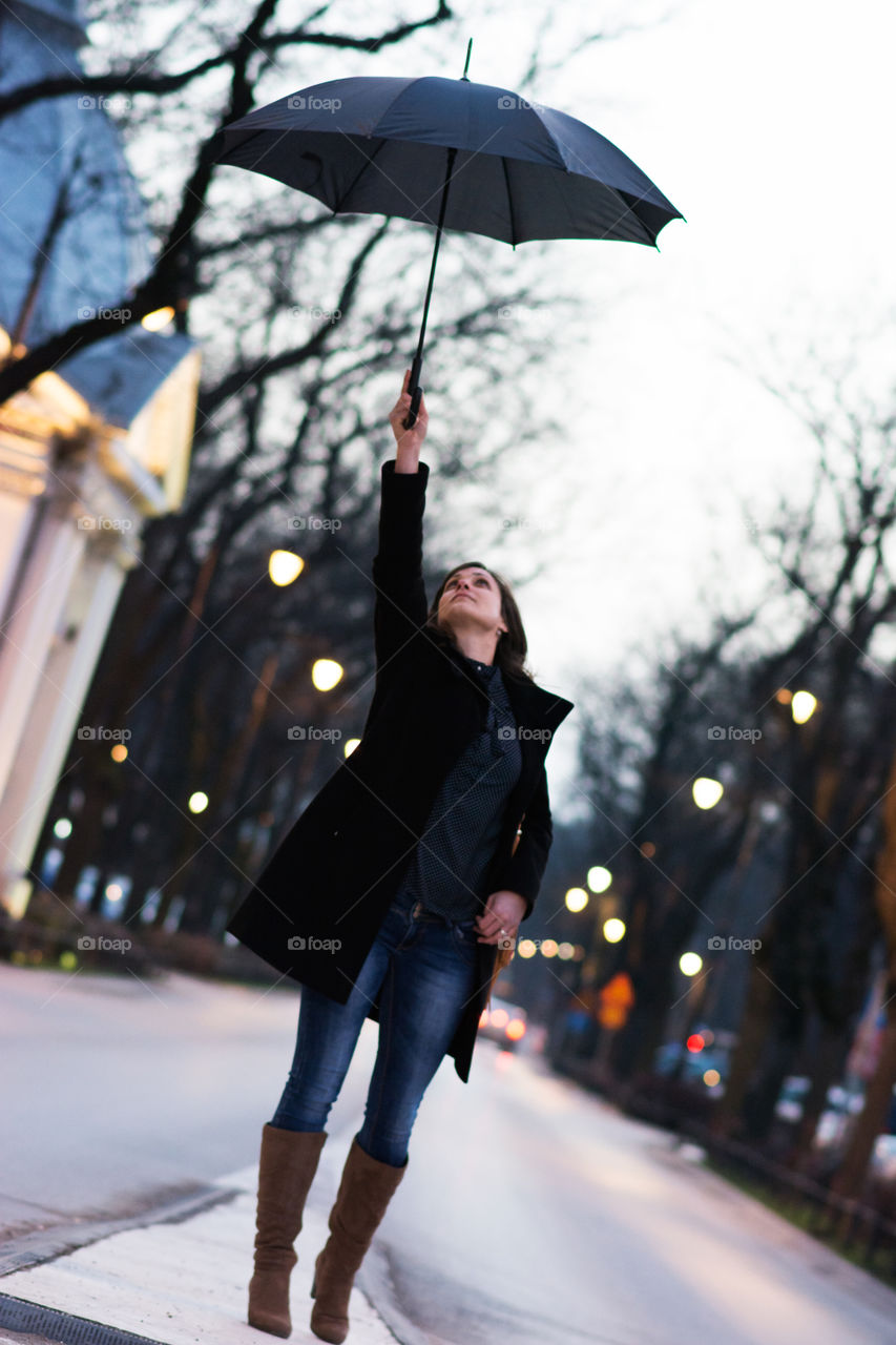 Girl with a umbrella in city