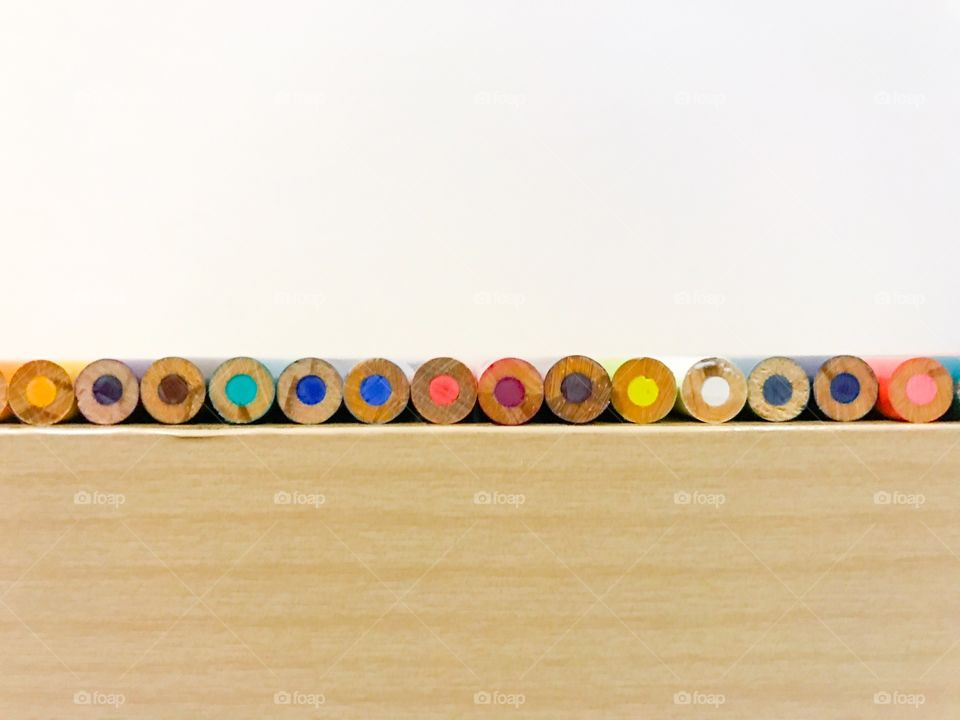 Colored pencils on a table.