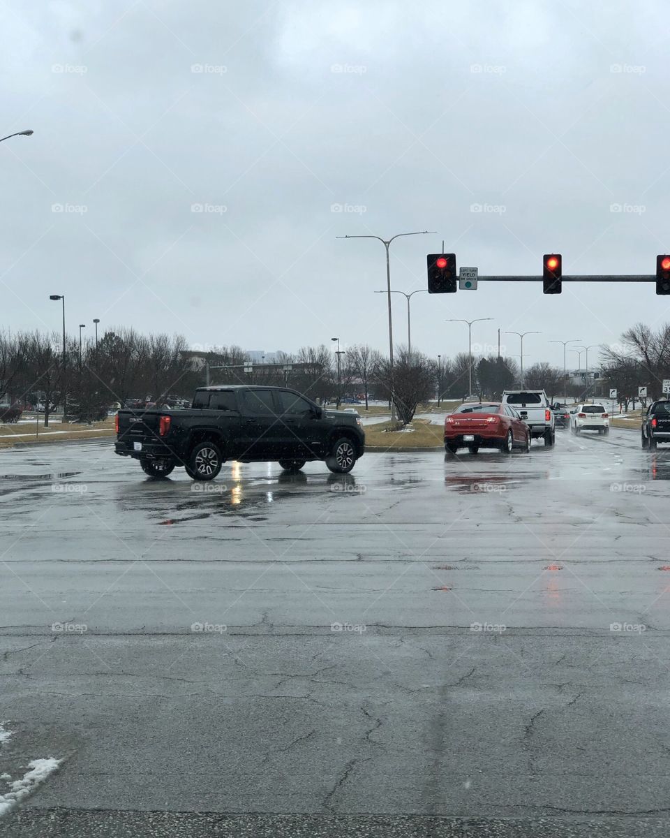 A busy intersection on a cold winter day in the city.
