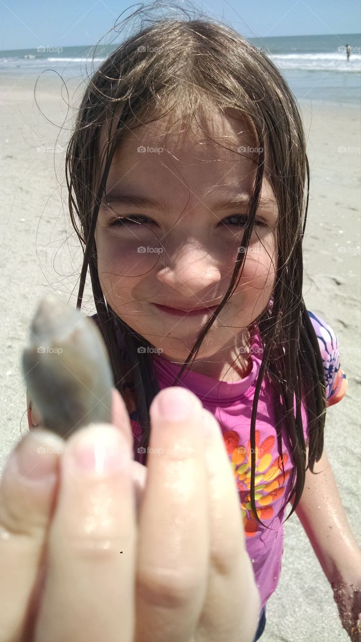 See. my daughter showing me a shell