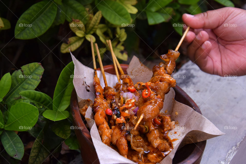 Indonesian satay, burnt chicken covered with sweet and thick spices