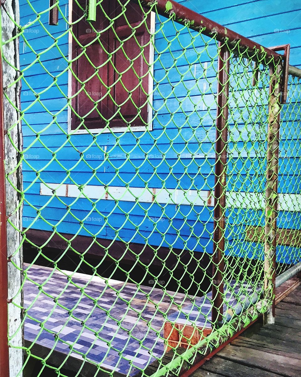 Chainlink fence in wooden building