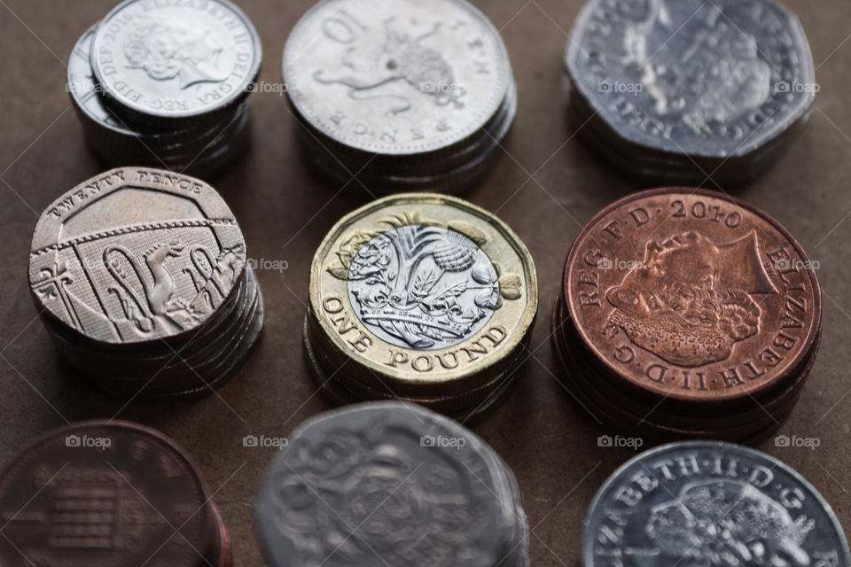 An assortment of British currency. Includes, 1p, 2p, 5p, 20p, 50p and £1.