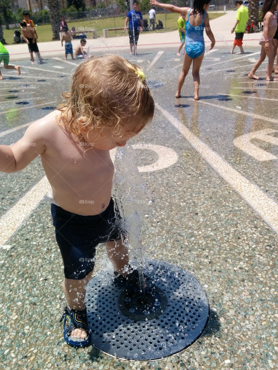 Stop the time. little girl playing with water