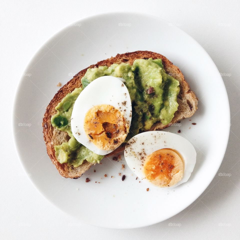 Boiled egg with toasted bread for breakfast