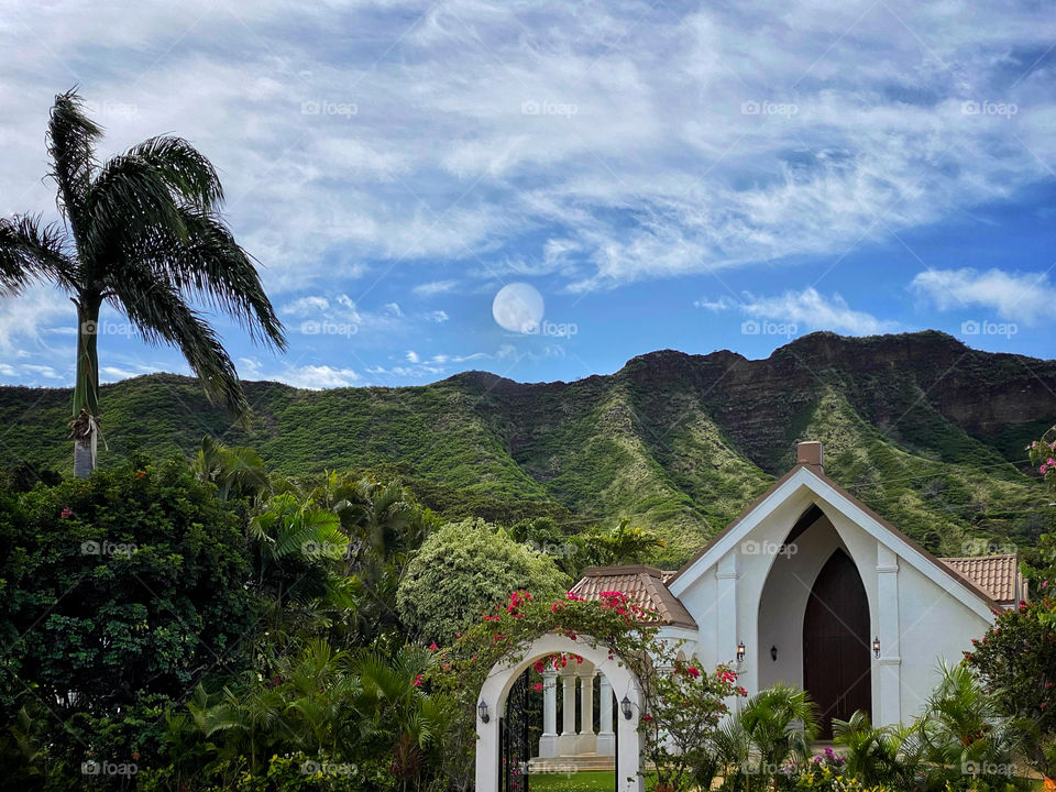 Daytime moon above a church in Hawaii 