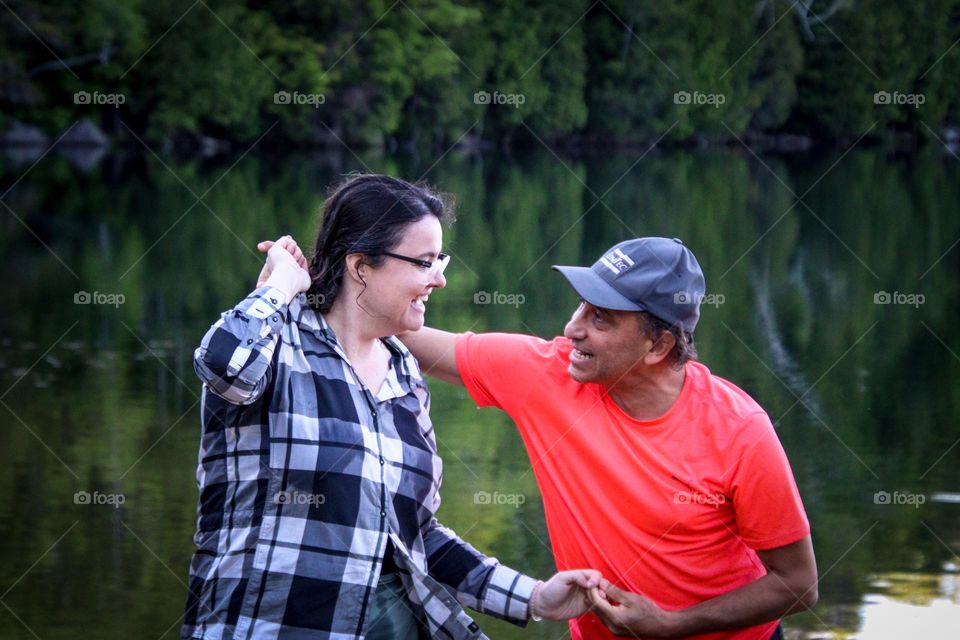 Lighhearted couple is dancing outdoors