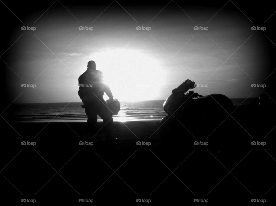 motorcycle ride on beach at sunset