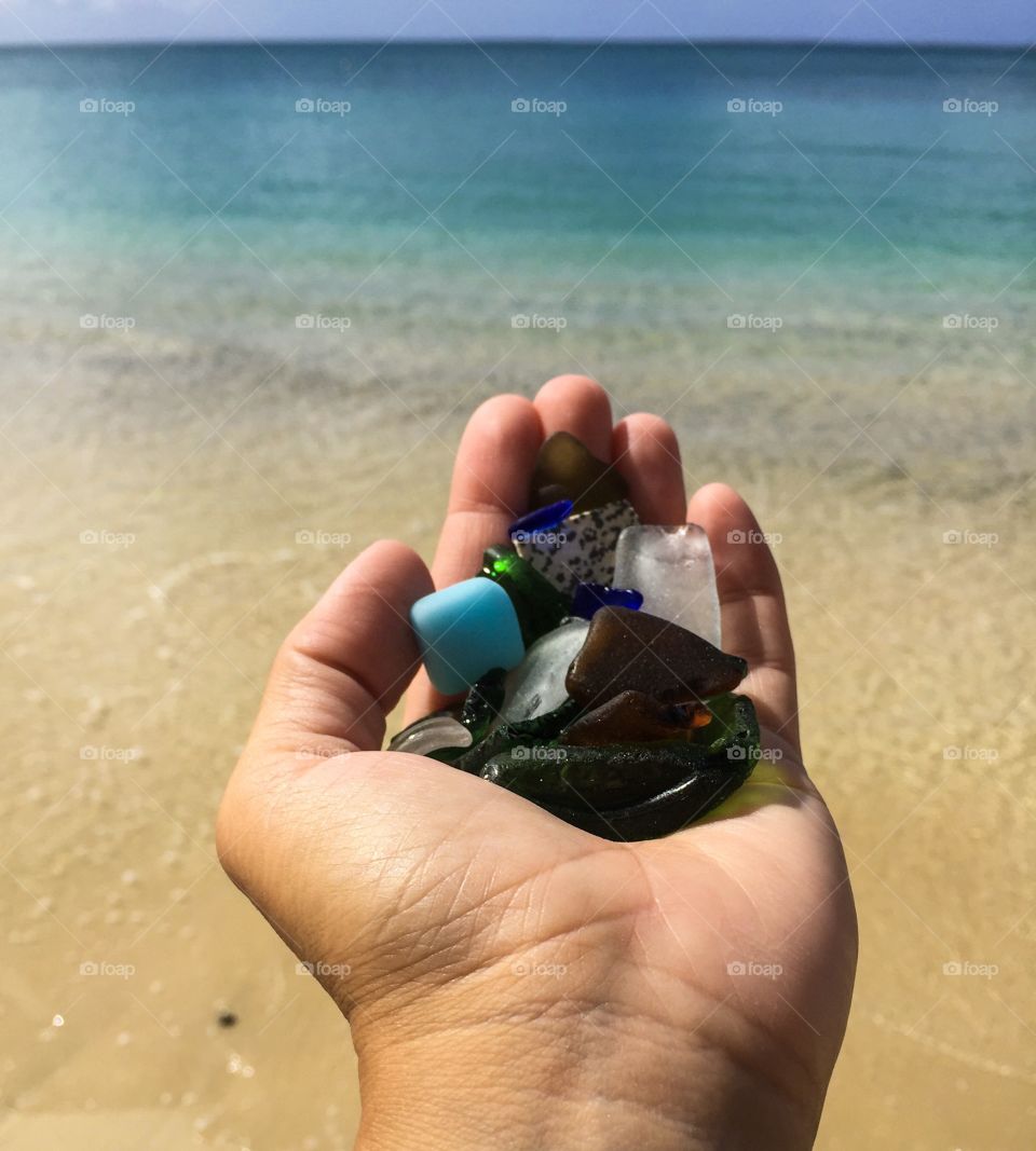 Hand Holding Sea Glass Ocean In The Background, Oceanside Portrait, Woman By The Ocean, View Of The Ocean Turquoise Waters Of The Caribbean 