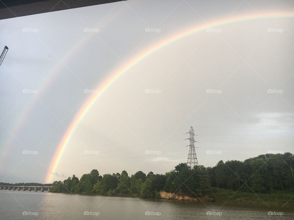 Double rainbow over lake