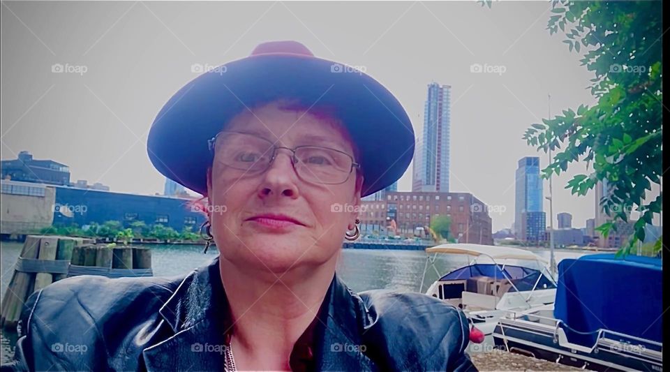 This is a self portrait at „Newtown Creek“ by the „Pulaski Bridge“ with „Greenpoint“, Brooklyn in the background. 2023. Hypnotic Productions