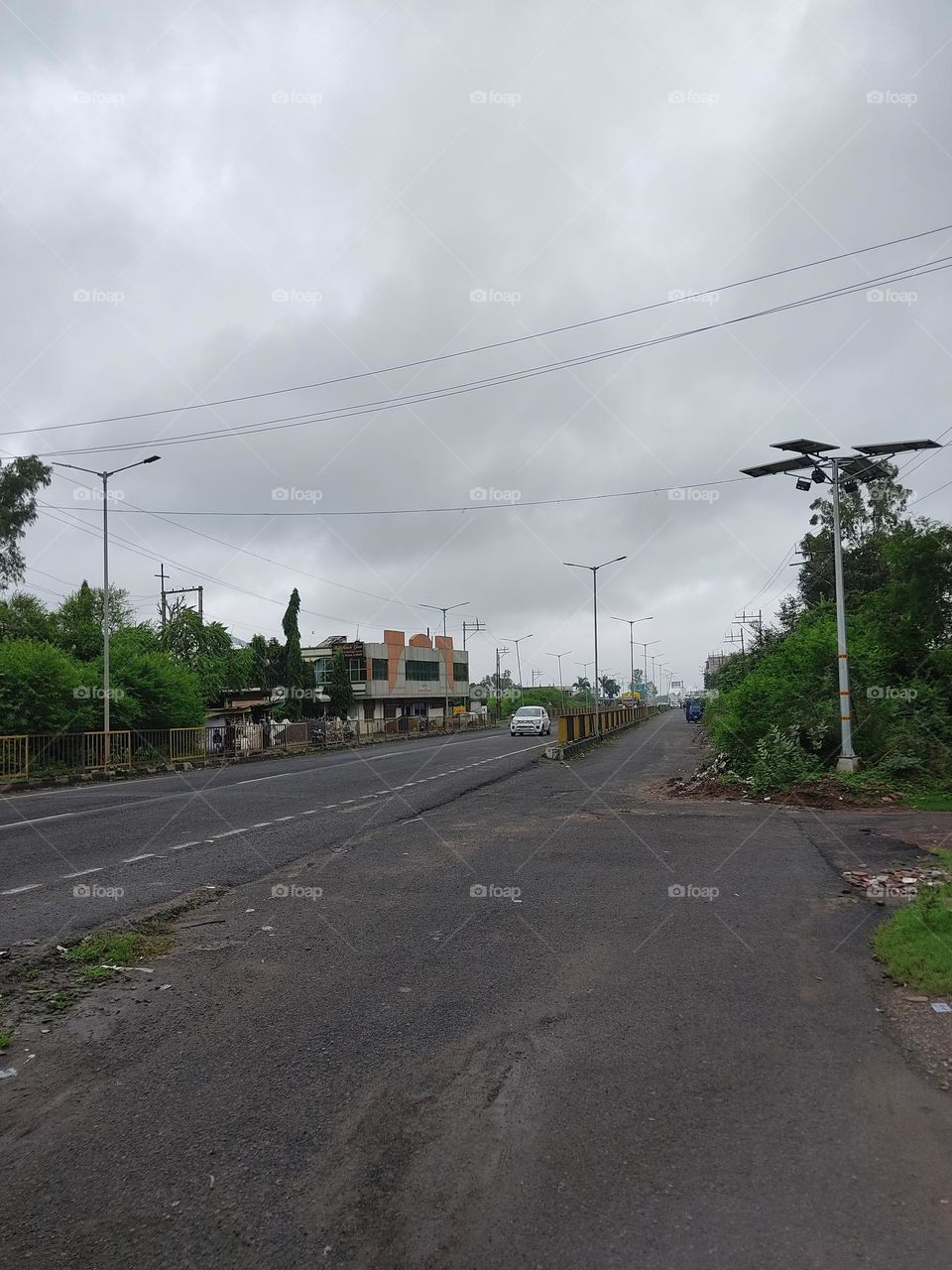 This is a car which is driving on the road, it shows us how good the season is in the desert, there is the rainy season, there is the hotel in Bagal, we take a long ride with it in such a nature that a man feels good in driving in peace.
