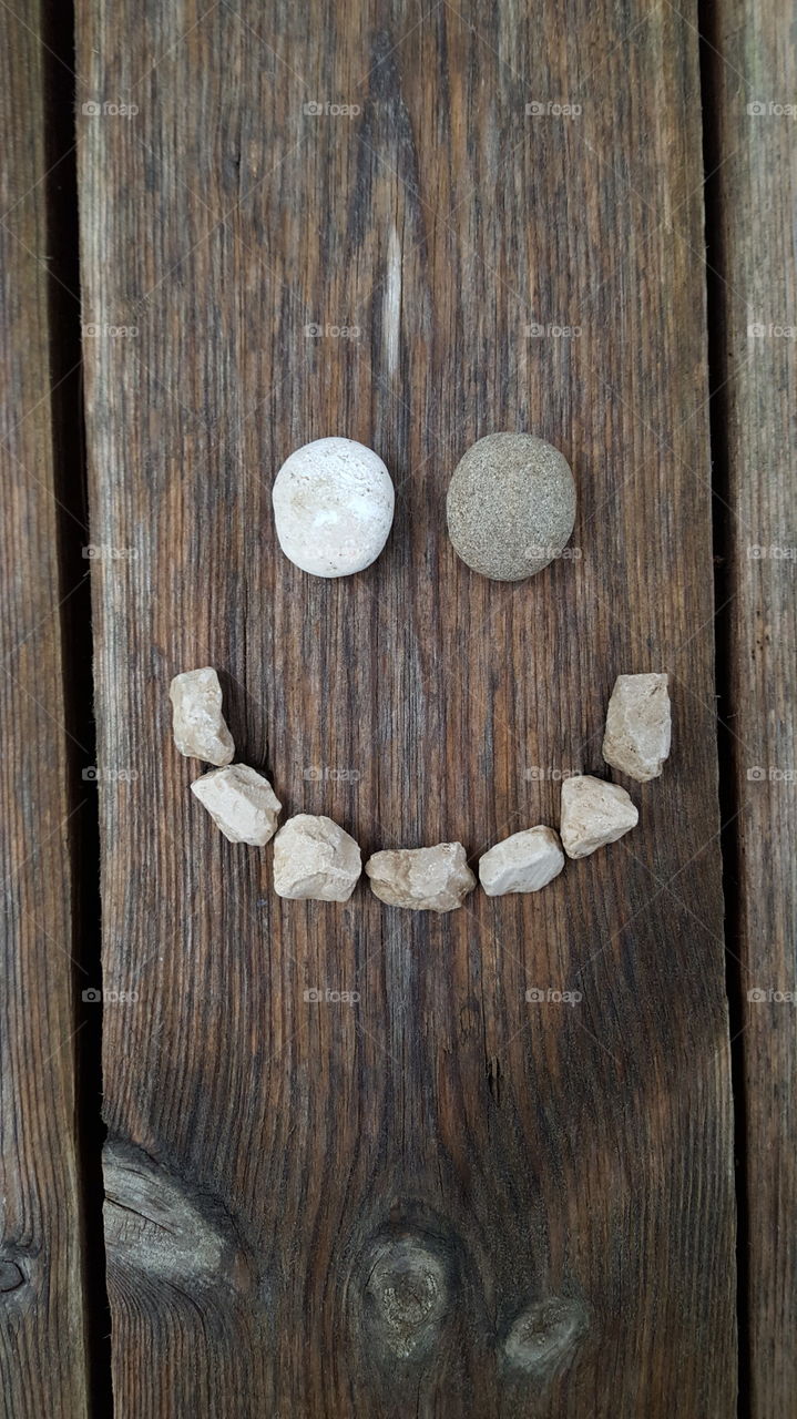 smiley face made with pebbles