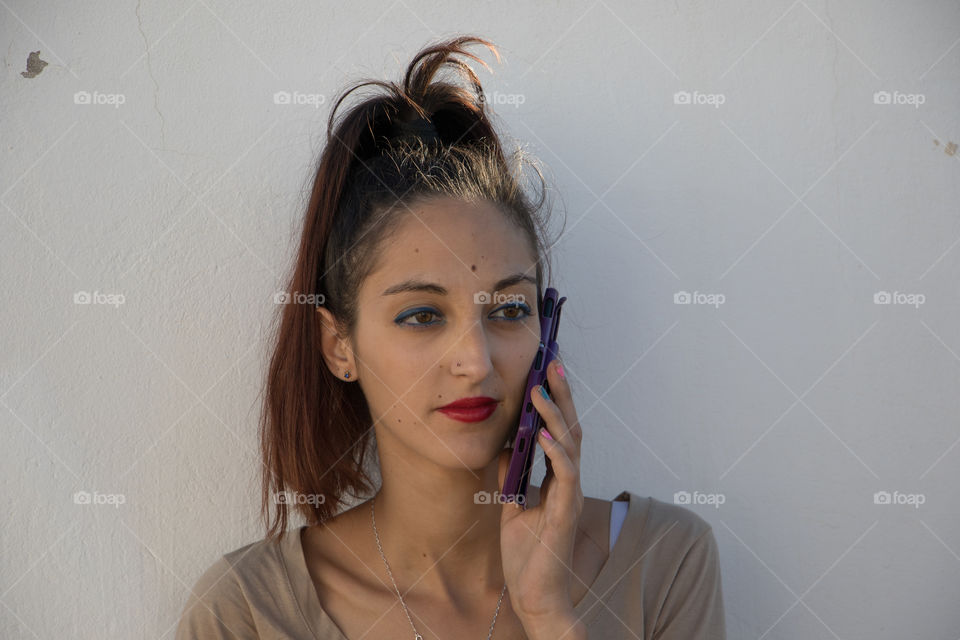 Woman talking by phone