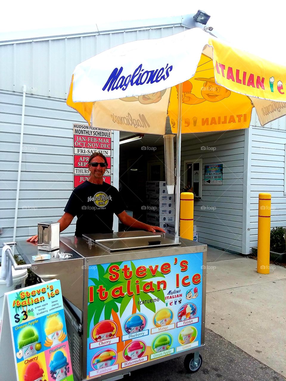Italian Ice vendor getting ready to do business for the day at the flea market