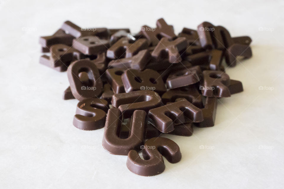 Chocolate letters in a pile 