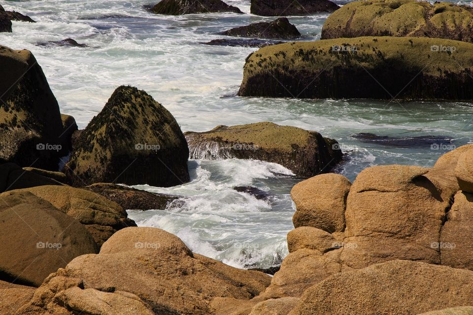 waves crashing on rocks