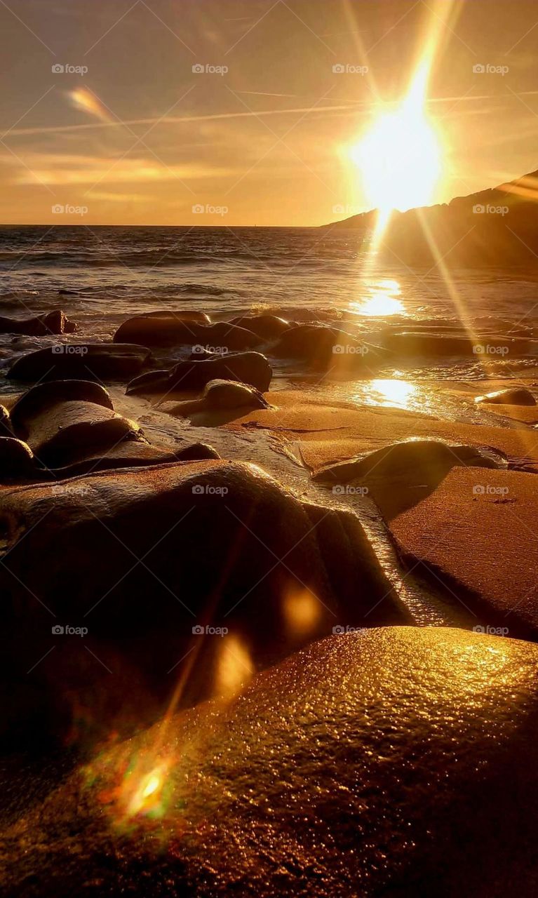 Sunset on sea sand and rocks in Quiberon