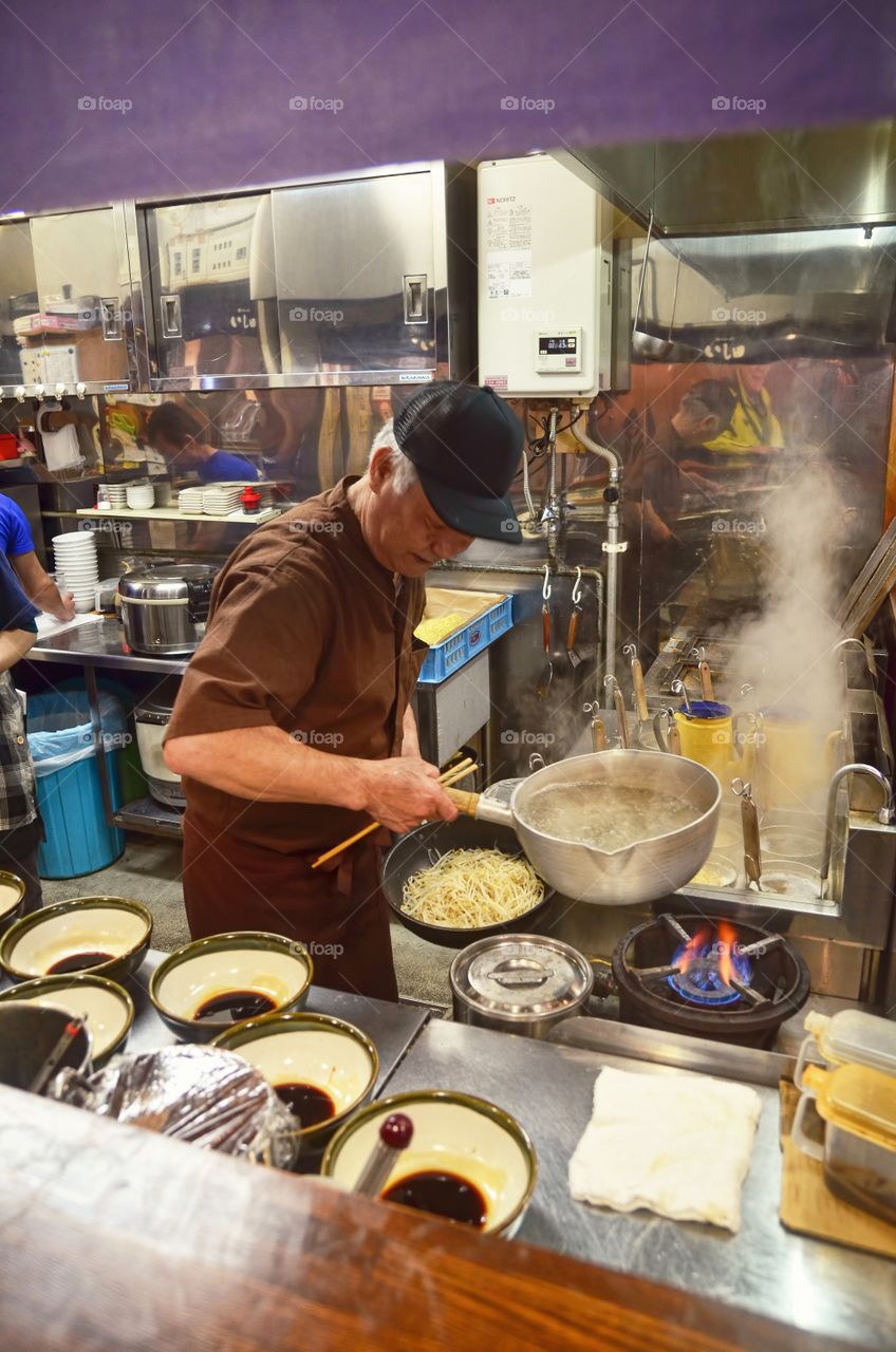 Chef is preparing for bowls of ramen in Asahikawa Ramen Village