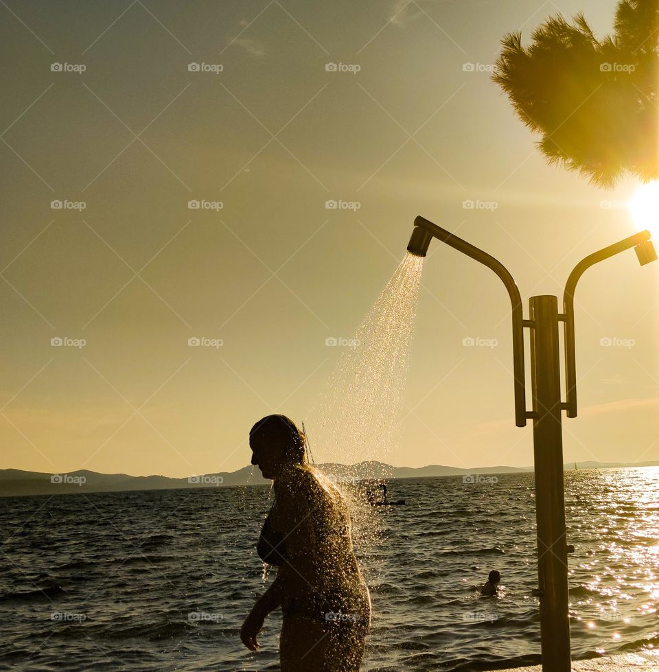 Hot summer shower on the beach