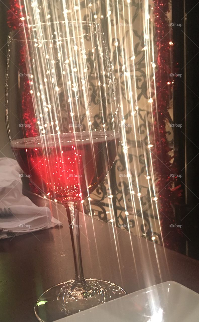 Glass of wine with light effect