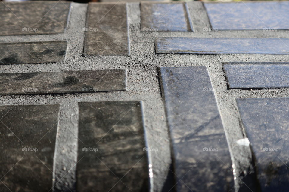 Glazed black vintage brickwork on Art Deco verandah 