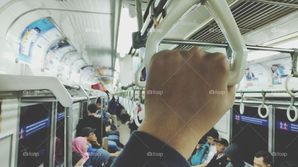 Hangin hand at train