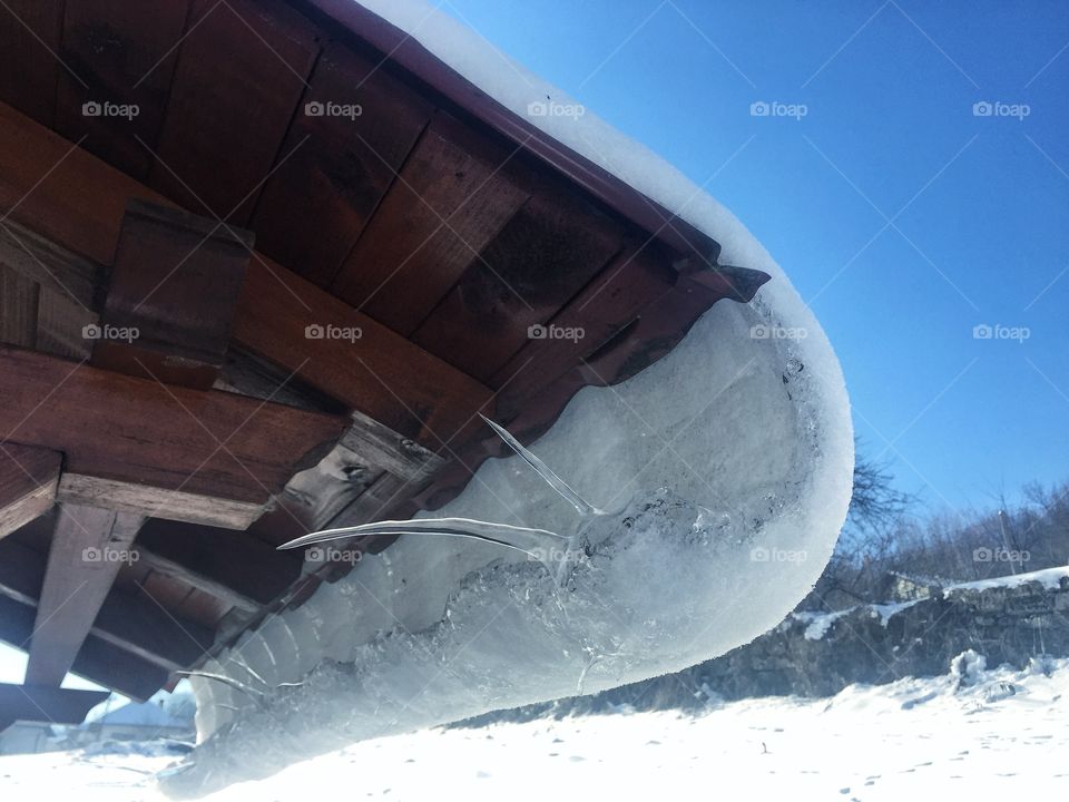 Frozen icicle on roof
