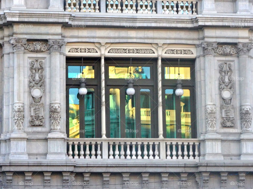 reflection on an old building in Madrid