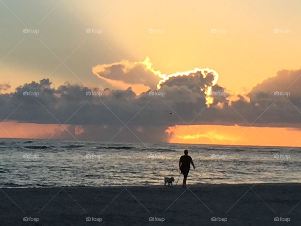 Walking the dog on the beach