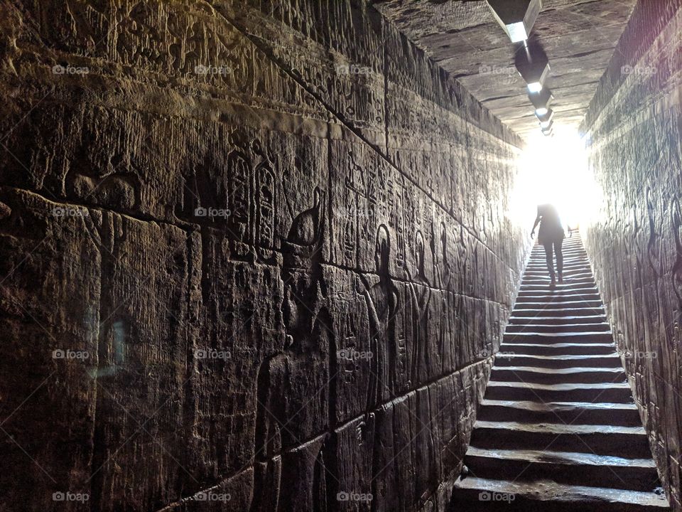 Descending the stairs inside the Temple of Edfu in Edfu, Egypt