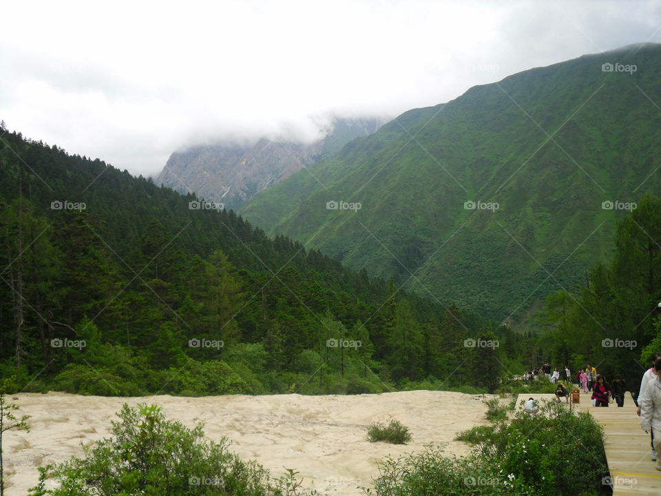 Scenic view of green mountains and river