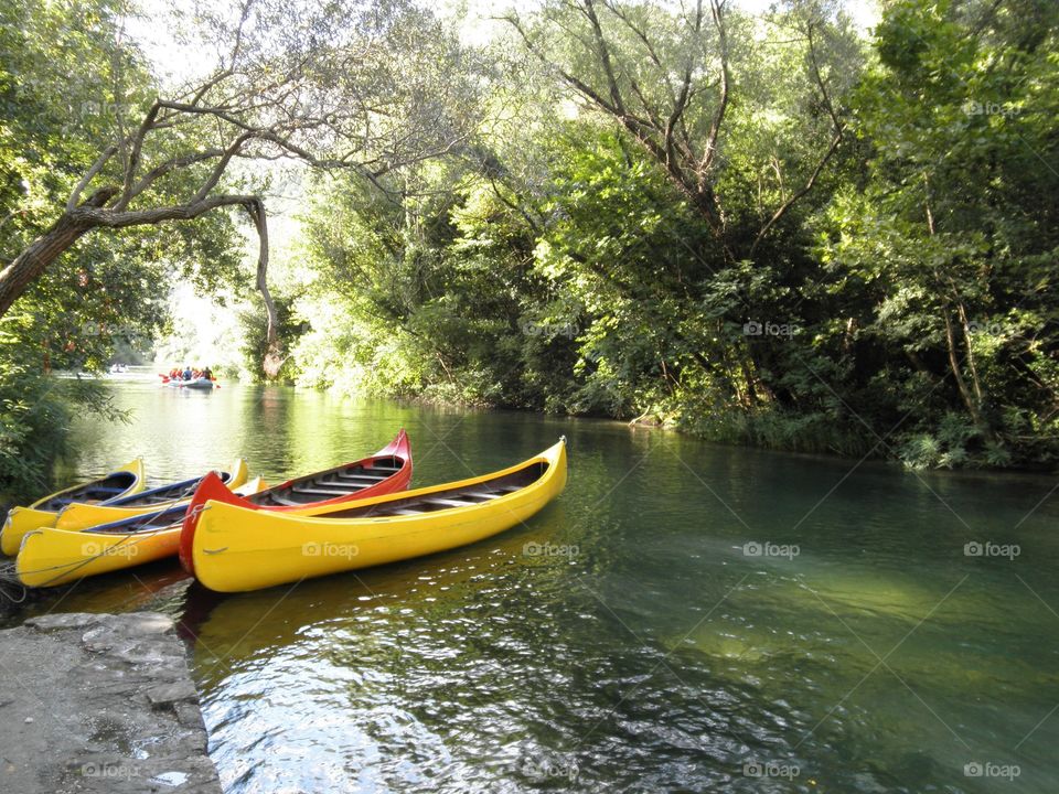Canoes wading on a river in Brela, Croatia